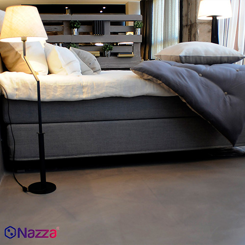 Dormitorio con suelo de microcemento, acabado continuo y elegante, que aporta calidez, uniformidad y un estilo moderno al espacio.